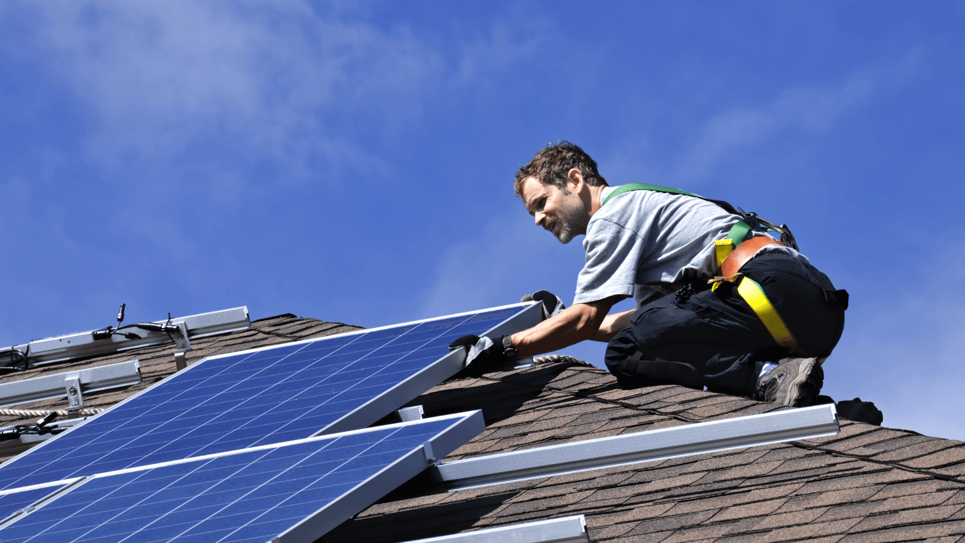 Man installing solar panels
